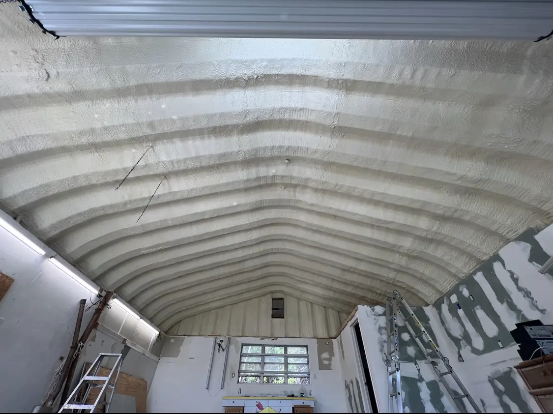 Spray polyurethane foam applied to the underside of a metal roof deck in Altoona